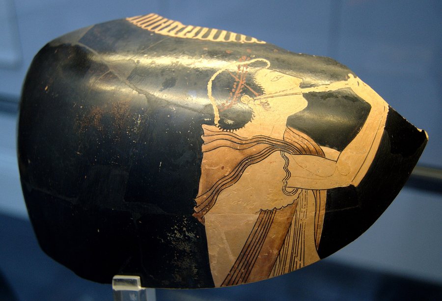 An aulos player on a Greek vase — original