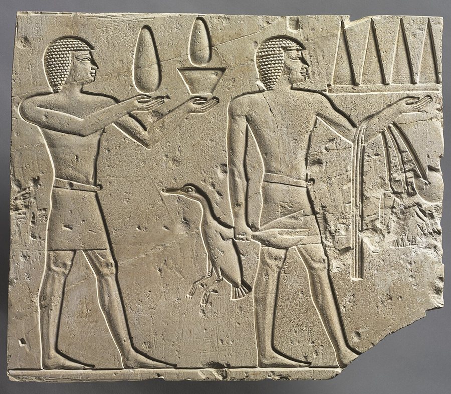 Two offering bearers with lotus — original