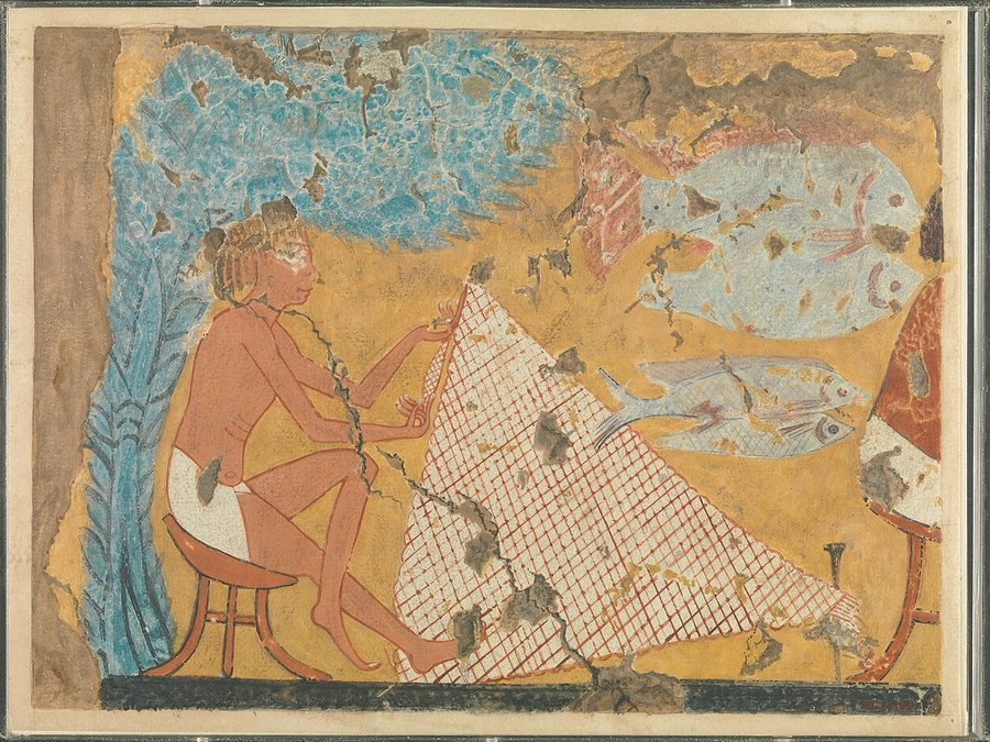 Man making a fishing net — original