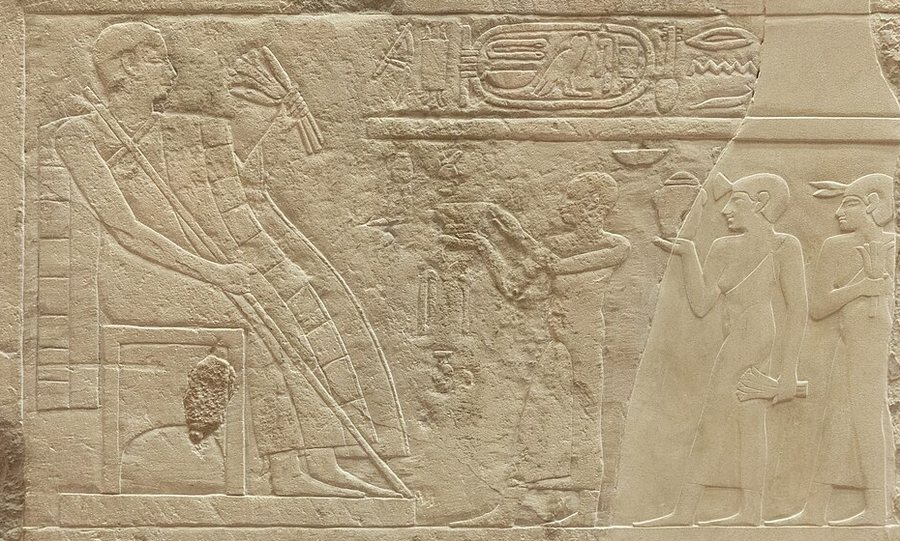 Owner receiving lily perfume (Louvre E 11377) — original