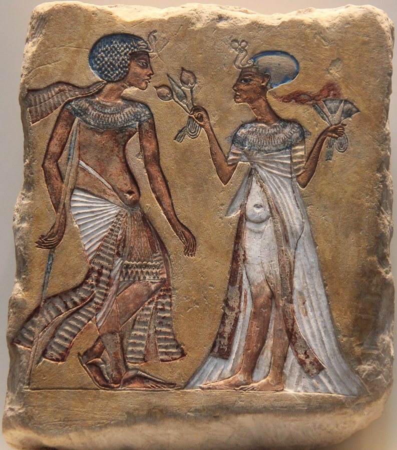 Painted relief of (probably) Akhenaten and Nefertiti strolling — original