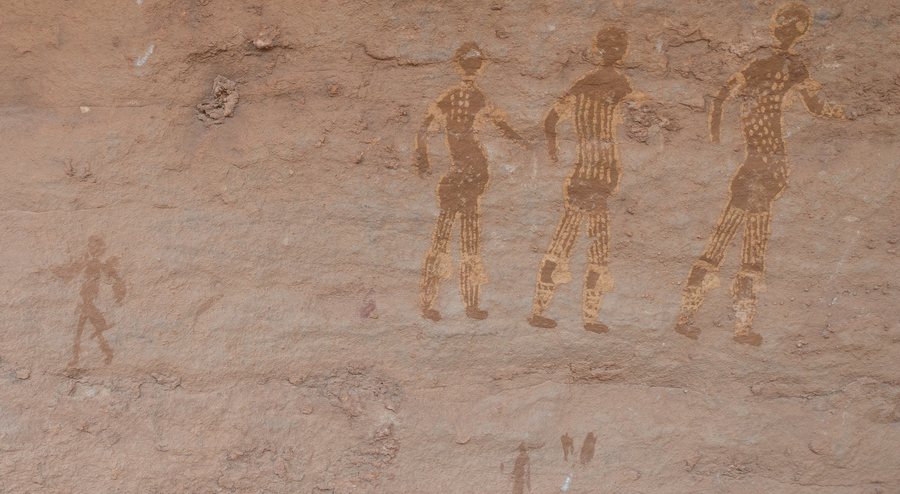 Figures in dotted yellow garments (Tassili rock painting) — original